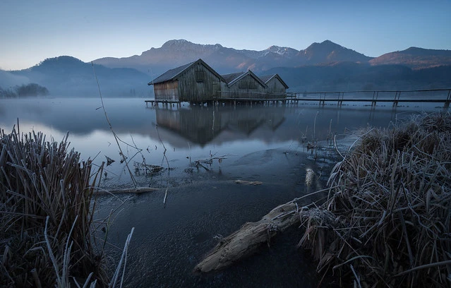 The first sun rays at the mountains behind lake Kochelsee