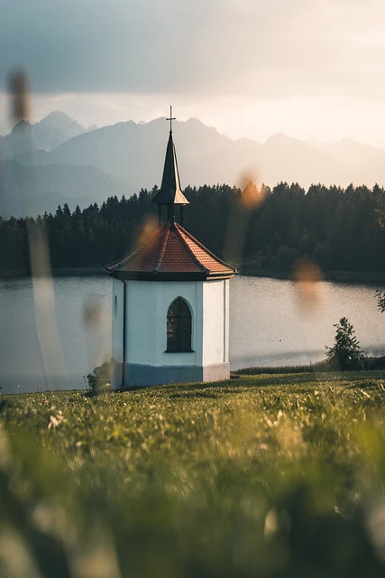 Sunset at lake Hegratsrieder See with a Chapel in front