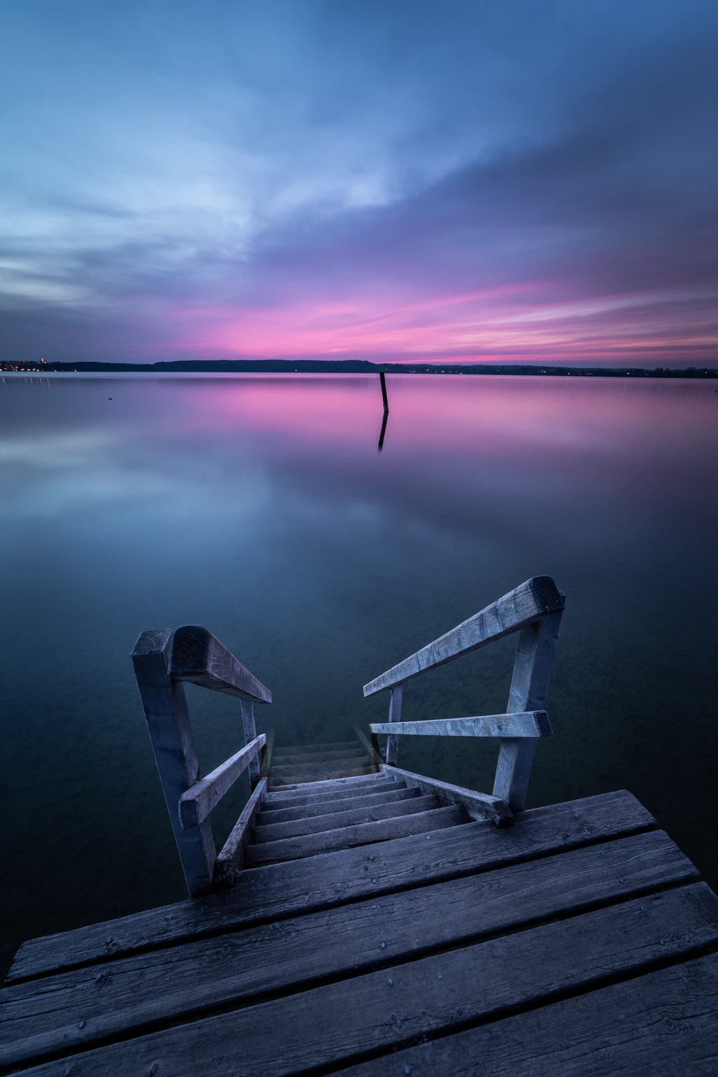 Steps leading into the silent waters of lake Ammersee