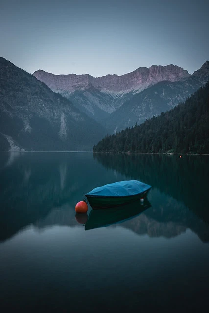 Lonely Boat in the Mountains at dawn