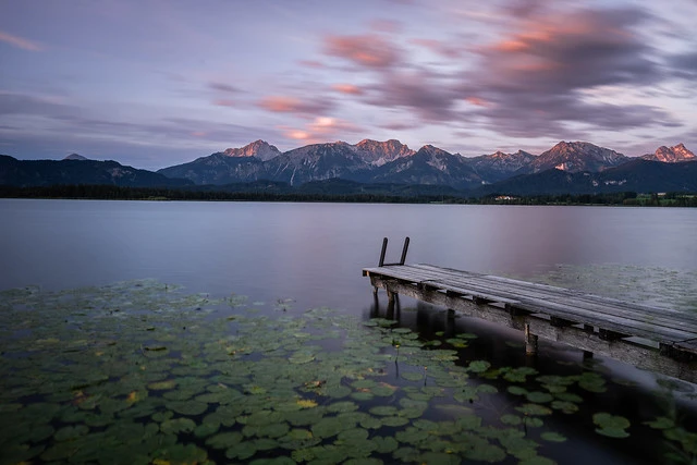 Plank at sunrise at lake Hopfensee in Allgäu, Bavaria, Germany