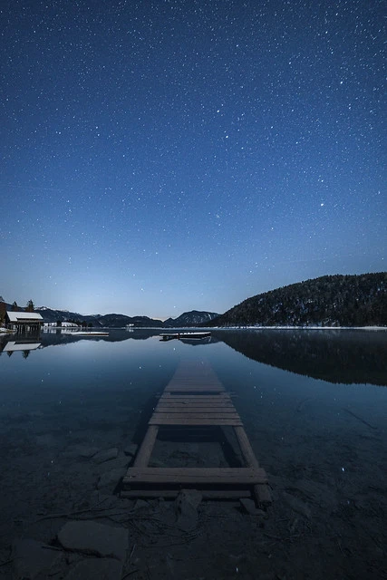 Night full of stars at lake Walchensee
