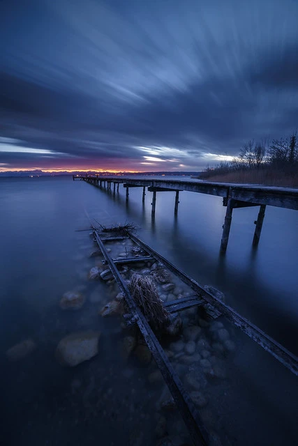 Old boat rails on a cloudy night at lake Ammersee