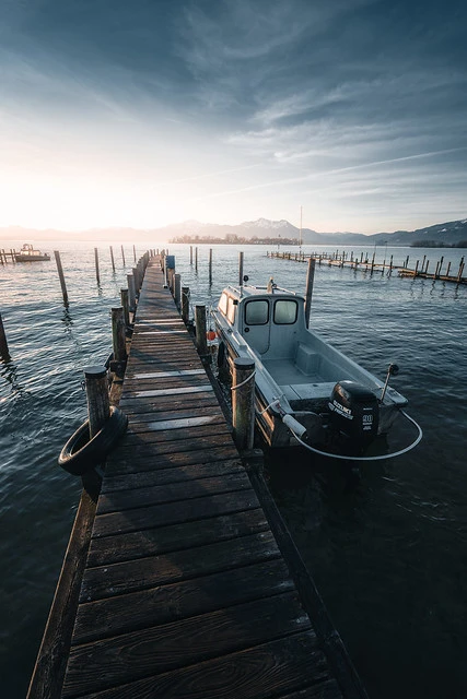 Plank with  Island Fraueninsel at the Chiemsee at Sunrise